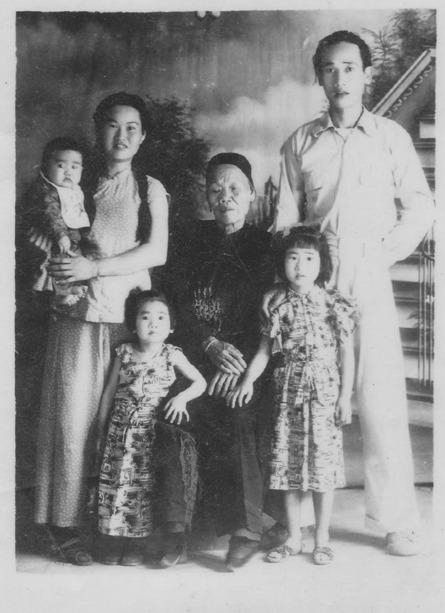 The old photograph of the author's family in China, taken in 1957, that brought on the family reunion over video call. 