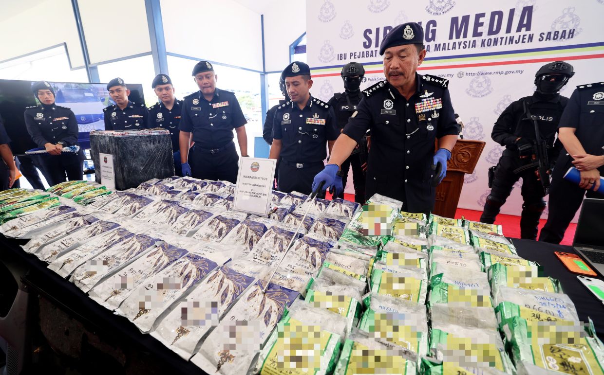 Police arrested two men and a woman and seized 159.8kg of me