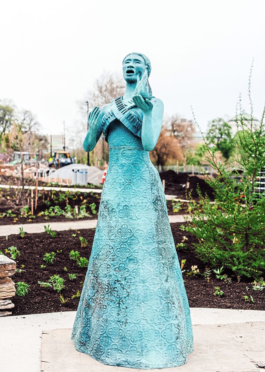 Alison Saar's bronze 'Torch Song,' inspired by the Statue of Liberty, in the restored Women's Garden at the Obama Presidential Center. Photo: Kevin Serna/The New York Times
