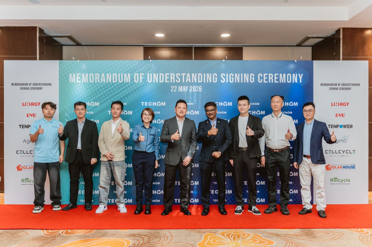 A smart collaboration: Sundarajoo (fourth from right), Josephine (fourth from left) and the Techom team posing for a group photo after a Memorandum of Understanding signing ceremony between strategic industry partners in Penang.