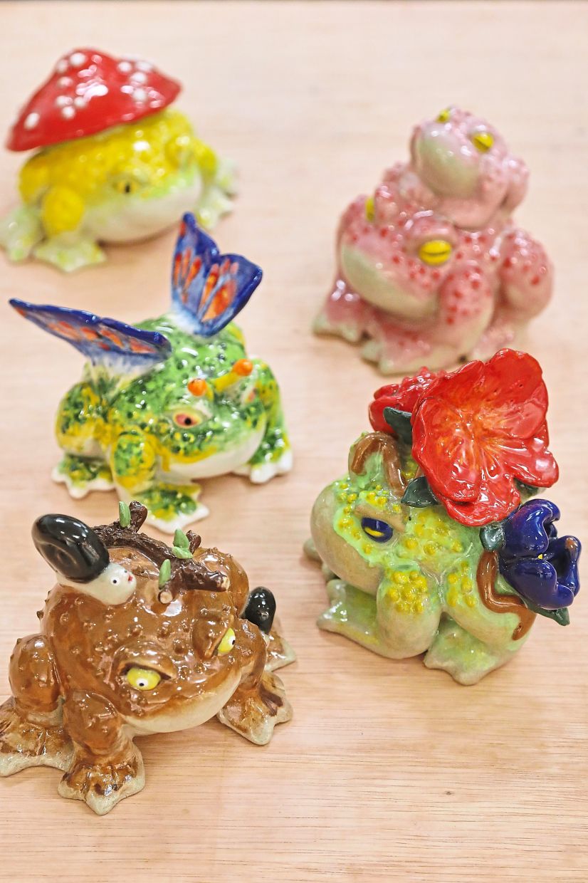 Ann’s whimsical clay frog creations showcase her creativity and playful imagination.