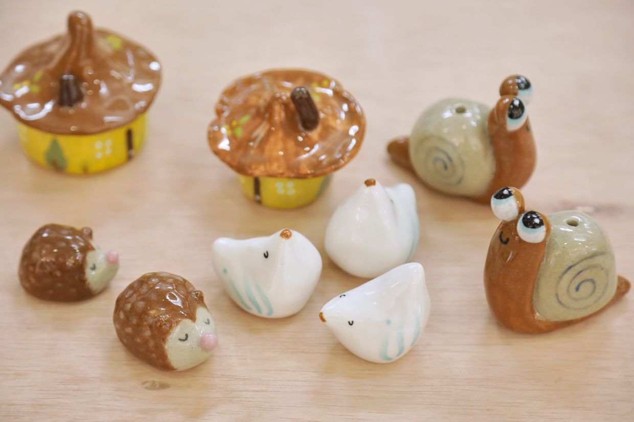 Some of the charming clay figurines handcrafted by Tan.