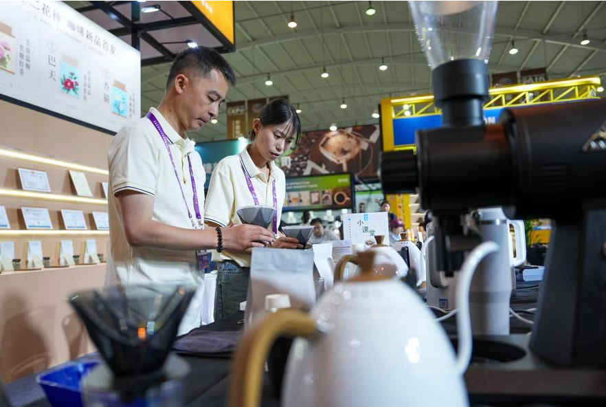 Exhibitors displaying coffee products at the 10th China-South Asia Exposition in Kunming. - Xinhua