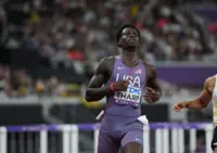 Athletics-United States' Tharp breaks 110m hurdles world record