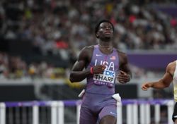 Athletics-United States' Tharp breaks 110m hurdles world record