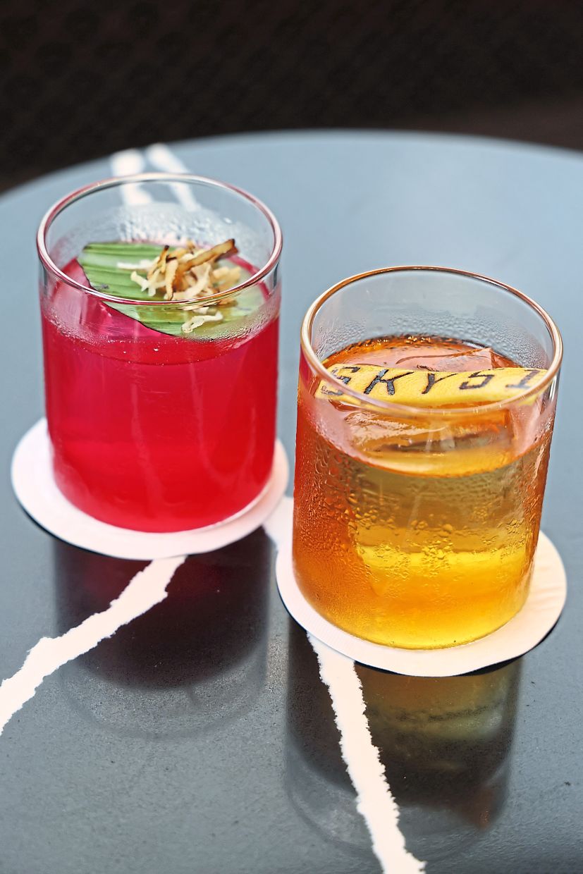 The Coco Loco (left) and Jackfruit Crusta at Blue@Sky51. — Filepics