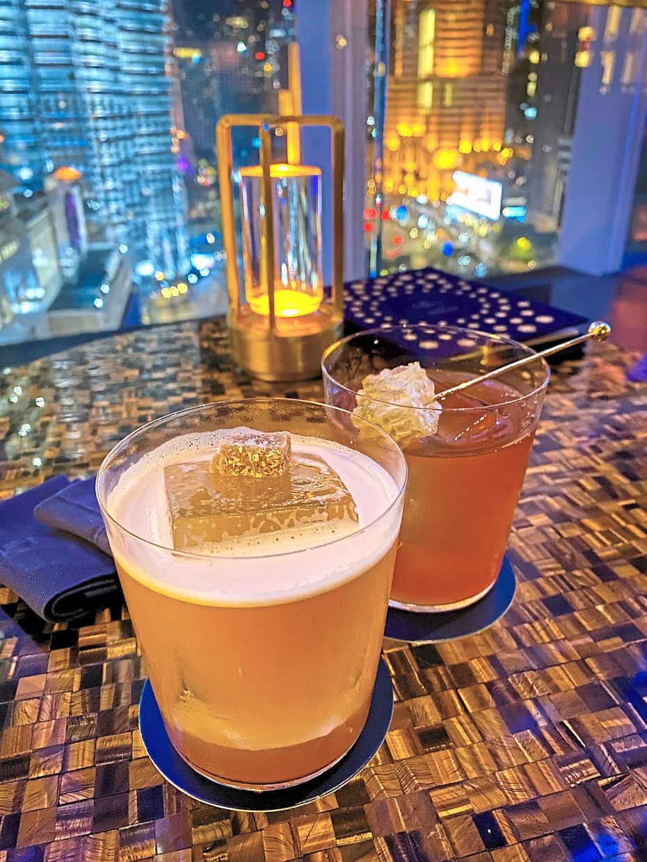The Bumblebee (back) and Penicillin at Bar Trigona are must-try drinks.