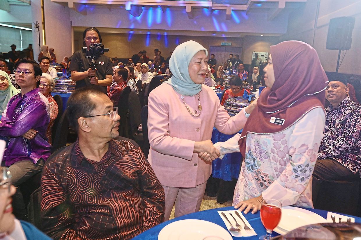 Protecting the vulnerable: Nancy (centre) greeting guests at the opening of TAGS new office in Kuala Lumpur and the launch of e-TAGS. — LOW LAY PHON/The Star
