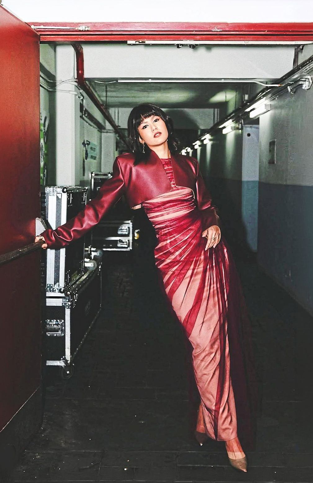 Juxtaposing soft and hard, this outfit pairs an artfully sculpted burgundy tulle dress with a leather bolero to create an edgy contrast. Photo: Instagram/Afiq Mohamed