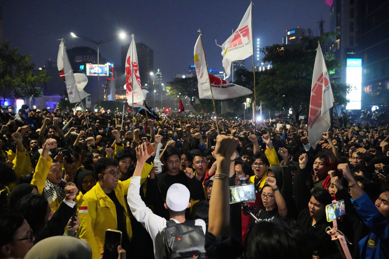 Student protesters shout slogans during a rally against a fuel price hike, government inefficient spendings, and military involvement in civilian affairs in Jakarta, Indonesia, on Friday, June 12, 2026. -- AP Photo/Dita Alangkara