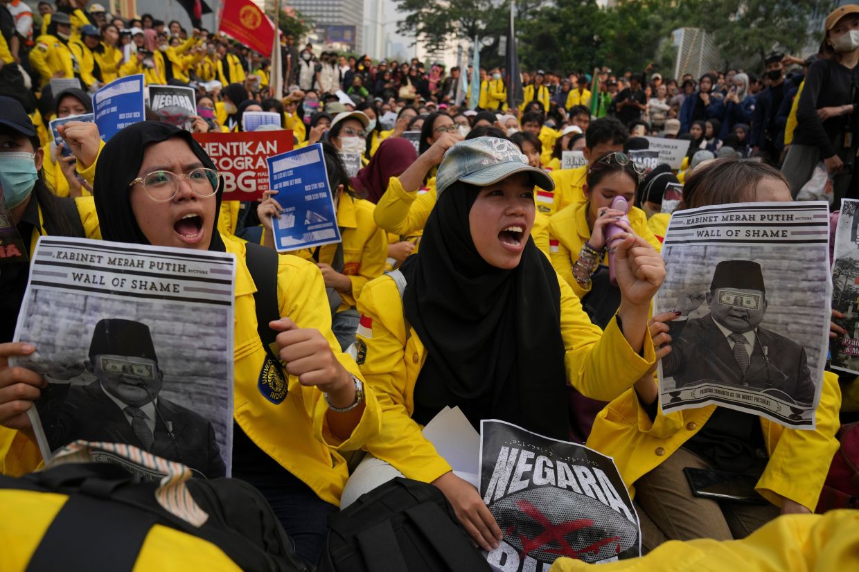 Student protesters shout slogans during a rally against a fuel price hike, government inefficient spendings, and military involvement in civilian affairs in Jakarta, Indonesia, on Friday, June 12, 2026. -- AP Photo/Dita Alangkara