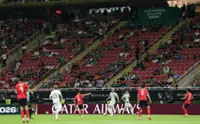 Soccer-Empty seats at World Cup match renews concerns over ticket prices
