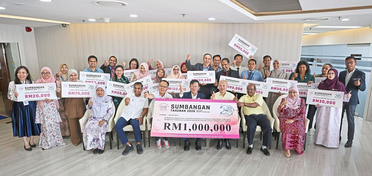 Chow (seated, centre) flanked by Chua (to his left) and Gooi after the press conference at Komtar. — CHAN BOON KAI/The Star