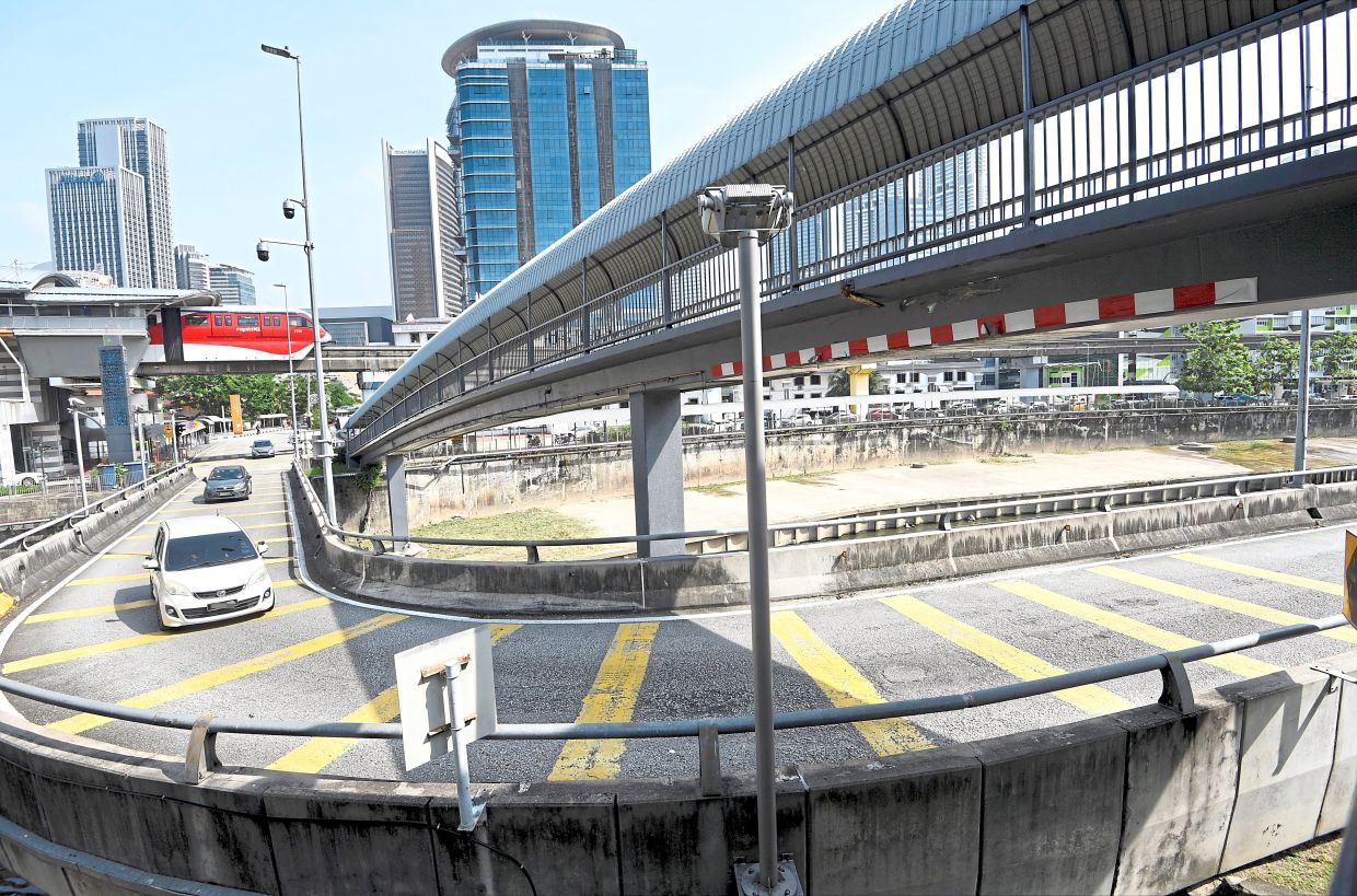 The ramp leads to several low clearance structures, including a pedestrian bridge.