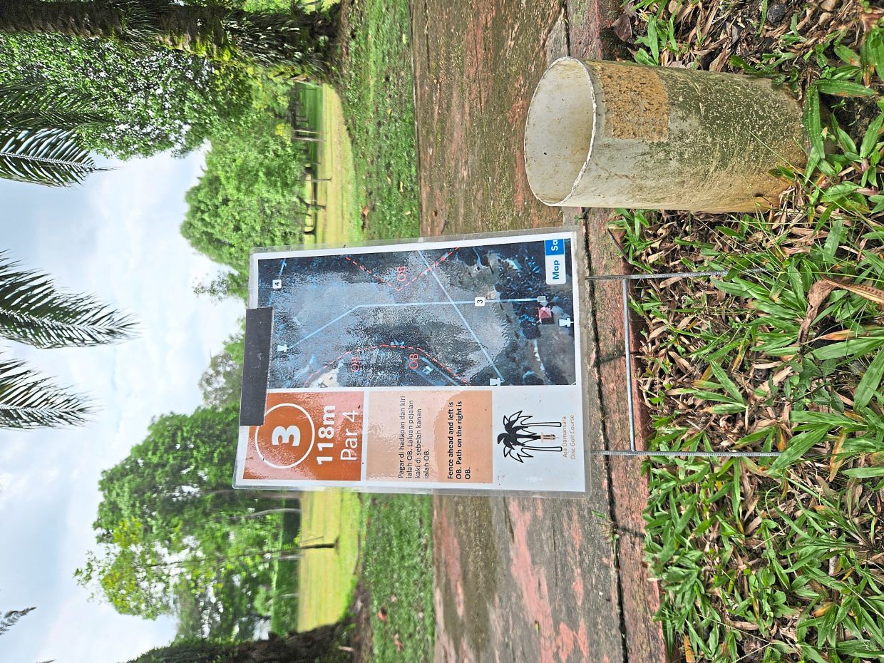 A tee marker at Ara Damansara park shows the distance, par and out-of-bound areas for one of the course’s holes.