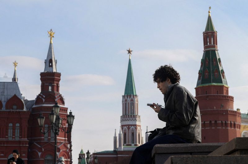 Two phones and an app: How Russians skirt Putin's digital iron curtain