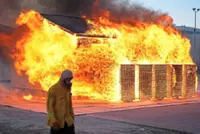 Scientists burn homes to figure out how to best protect them in wildfires