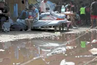 Rain, aftershocks hamper rescuers