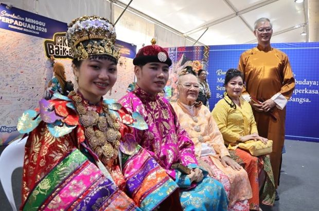 Participants showcase traditional bridal attire from various ethnic communities.