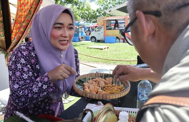 Visitors sample traditional delicacies.