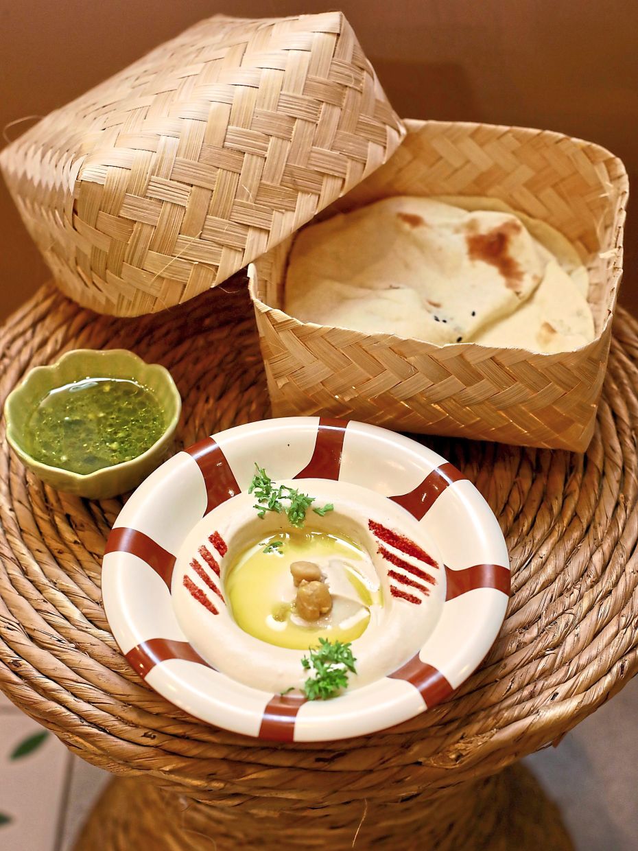 The creamy hummus is given a fiery kick, courtesy of the spicy green chilli dip paired with it.