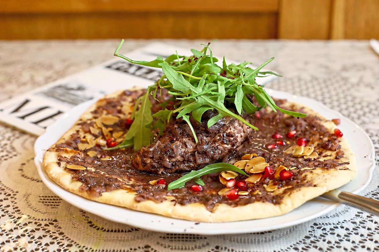 Musakkhan is a traditional Palestinian dish that features chicken cooked with onions, sumac and olive oil layered over traditional bread.