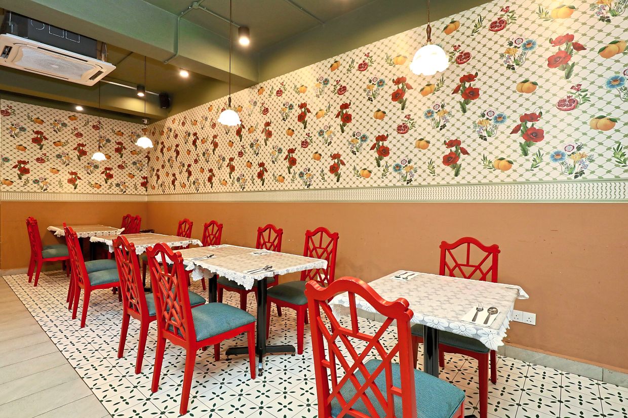 The restaurant is perched along a quiet street and has a cosy, floral charm.