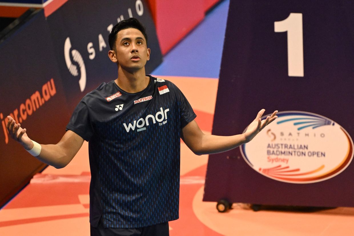 Indonesia's Alwi Farhan reacts during a game point review against China's Dong Tian Yao in the men's singles final at the Australian Open badminton tournament in Sydney on Sunday, June 14, 2026. -- Photo by Saeed KHAN / AFP
