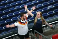 Rain sends Germany and Curacao fans on pre-match hunt for umbrellas and beer