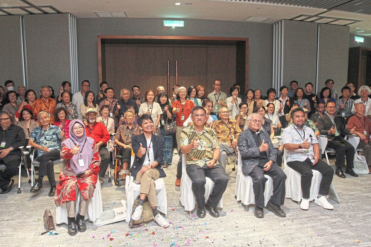 (From second left) Haryany, Wong, Prof Lin, Erry Arham and other guests posing for a group photo at the exhibition’s opening ceremony.