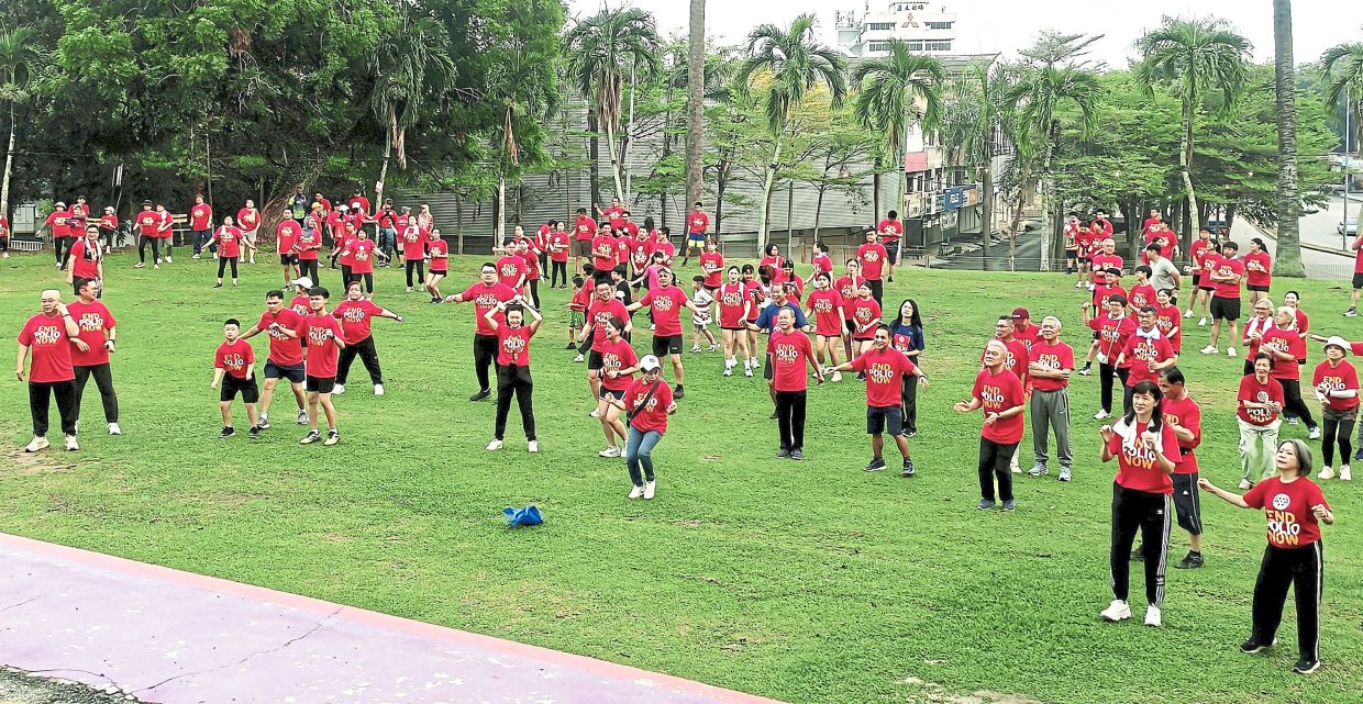 Some of the 300-strong crowd warming up for an activity focused on well-being and awareness of polio.