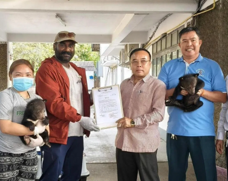 Karthiriish (second from left) has helped rescue 30 bears since joining Free the Bears. -COURTESY OF KARTHIRIISH CHANDRA