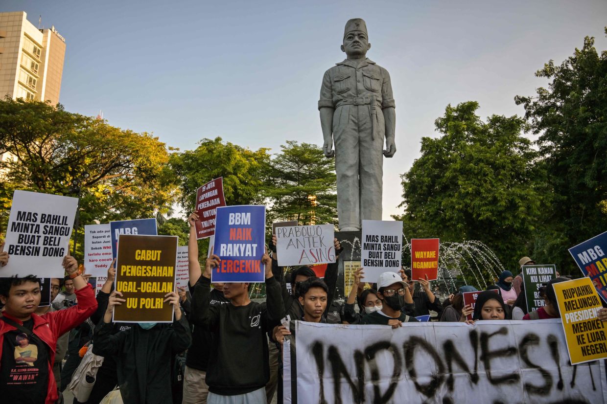 Students protest against a rise in non-subsidised fuel prices and call on the authorities to halt the free school meals programme (MBG), in Surabaya on Monday, June 15, 2026. -- Photo by JUNI KRISWANTO / AFP