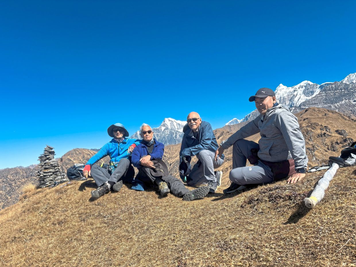 The writer (far left) and his friends are determined to make the most of their 'golden years' and travel more.