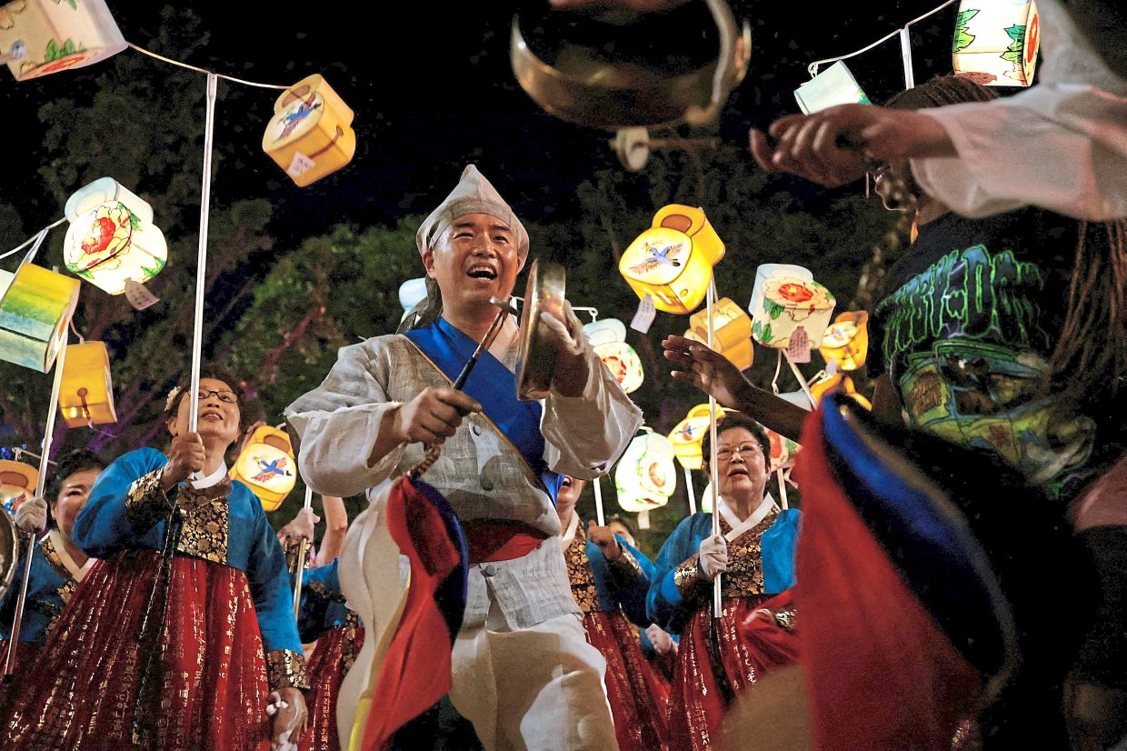 Buddhist devotees performing in a dazzling Lotus Lantern parade, a 1,200-year-old unesco Intangible Cultural Heritage spectacle of vibrant lantern displays and processions, in seoul, south Korea. — Reuters