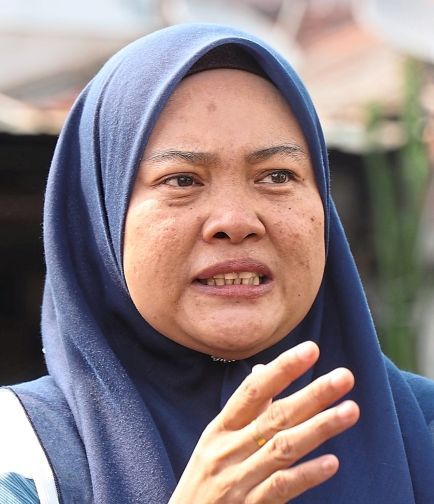 Nini says road markings in Taman Meru Indah, Klang, urgently need to be repainted.