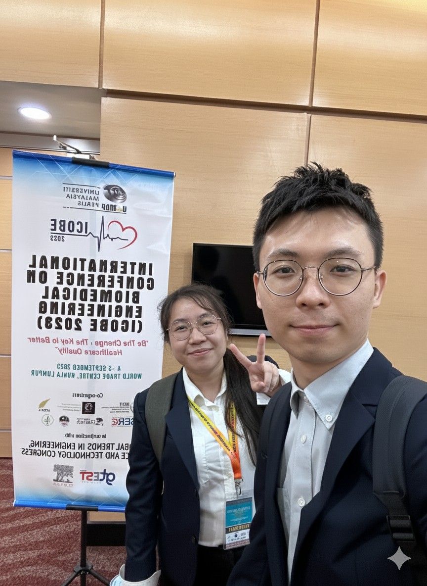 Tan (right) with his student, Chai Ling attending a conference on biomedical engineering.
