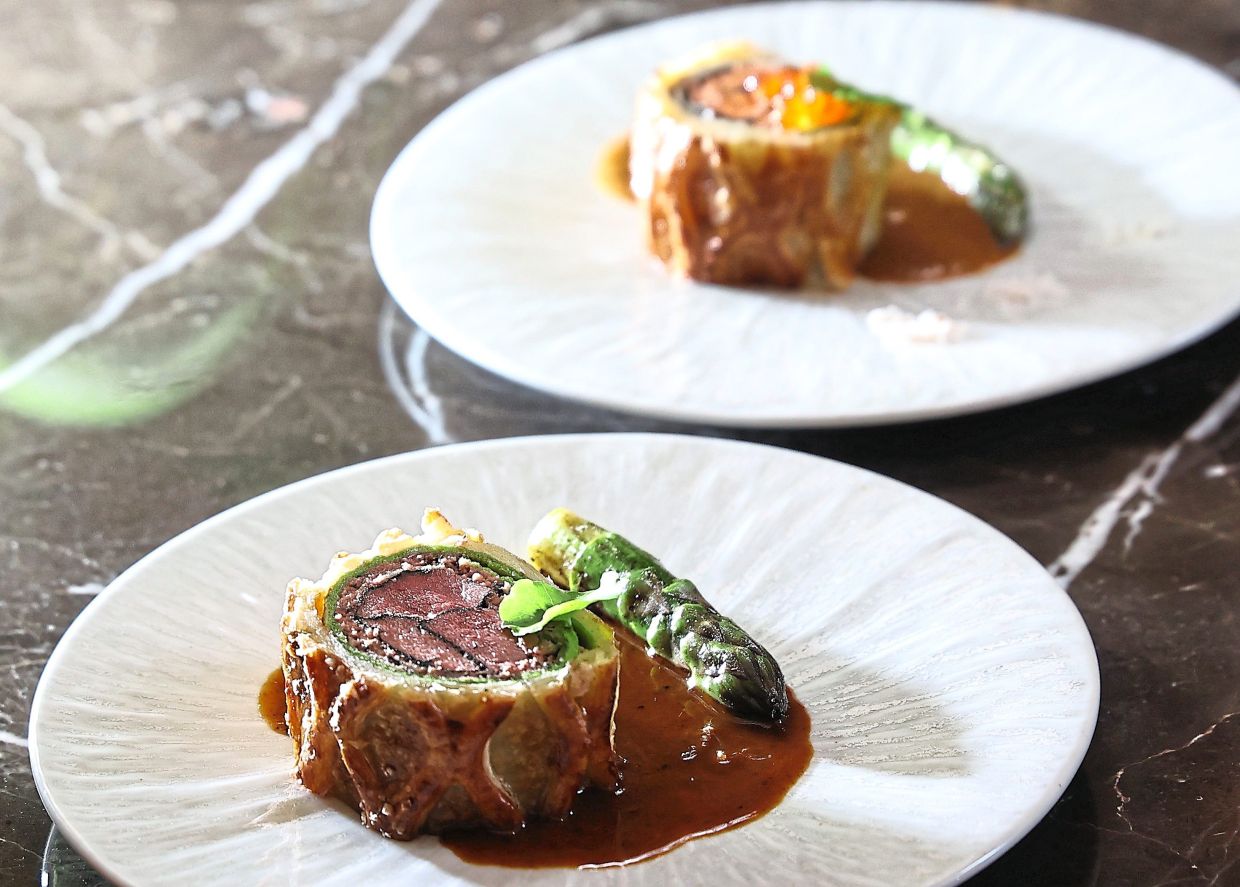 The beef Wellington (front) and salmon Wellington are available on weekends.