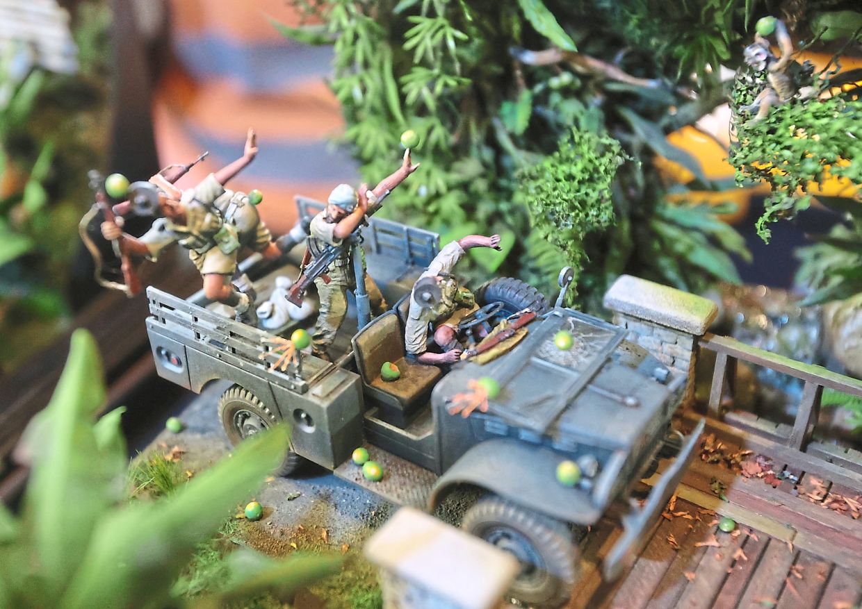 Close-up of the police convoy being pelted with fruits by angry monkeys.