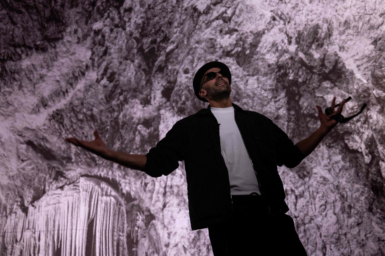 French artist JR poses as he wears 'Specs' augmented reality glasses inside his latest art installation 'The Pont Neuf Cave' on the Pont-Neuf bridge in Paris. Photo: AFP 