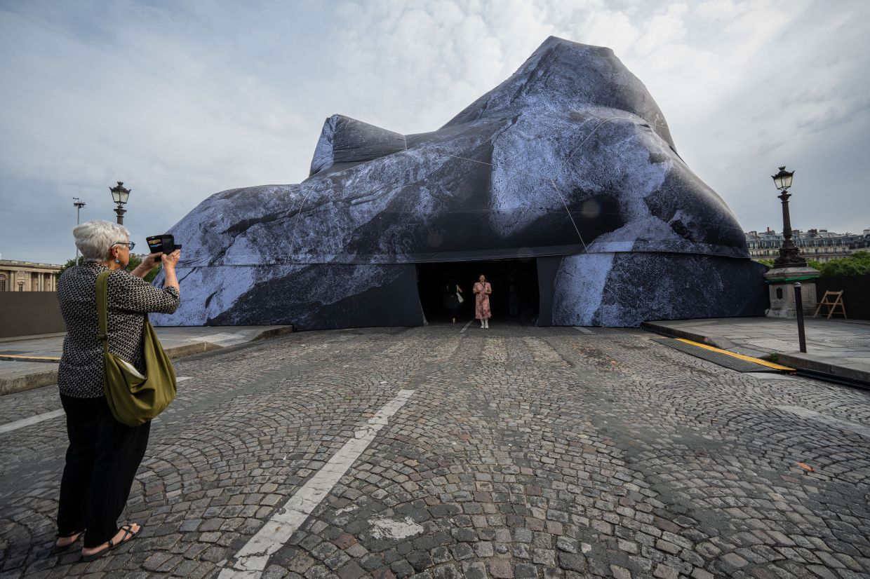 When the 'The Pont Neuf Cave' installation closes, its fabric will be reused or recycled. Photo: AP 