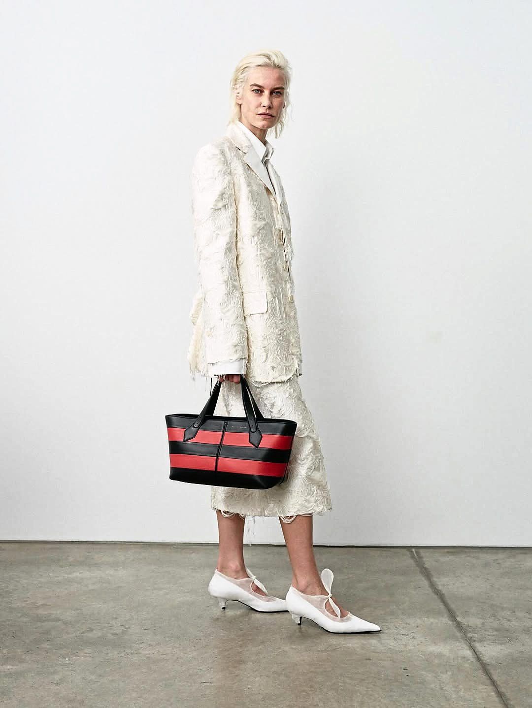 A timeless wardrobe staple, the skirt suit blends polish and power in one streamlined silhouette. Photo: Proenza Schouler