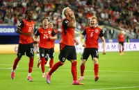 Soccer-Austria return from long World Cup absence with nervy 3-1 win over Jordan