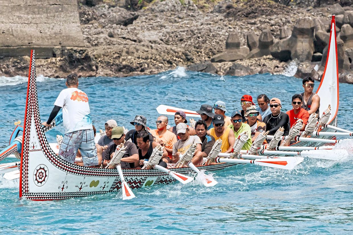 Others participating in a test row off Orchid Island, in southeastern Taiwan, on the eve of its planned voyage to the Philippines’ Batanes Islands. — AFP
