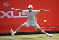 Tennis-Clinical De Minaur eases into Queen's quarter-finals