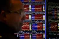 Wall Street sinks on bets Fed will hike rates this year