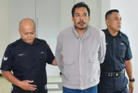 Salesman pleads guilty to attacking biker on Federal Highway