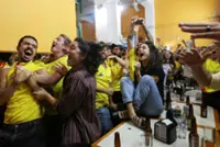 Soccer-Mexico City turns yellow as Colombian fans make Azteca feel like home