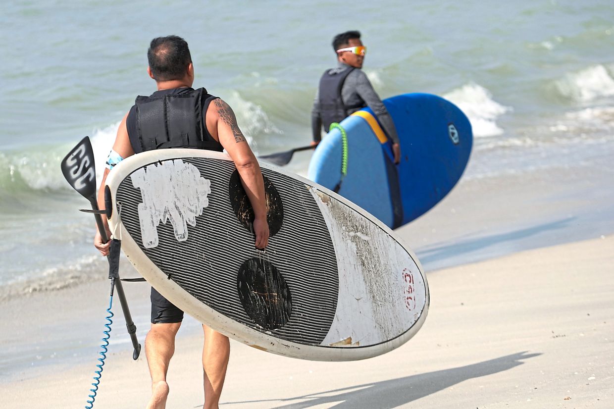 Competitors heading out for the SUP event which is hoped to popularise the sport of paddleboarding. 