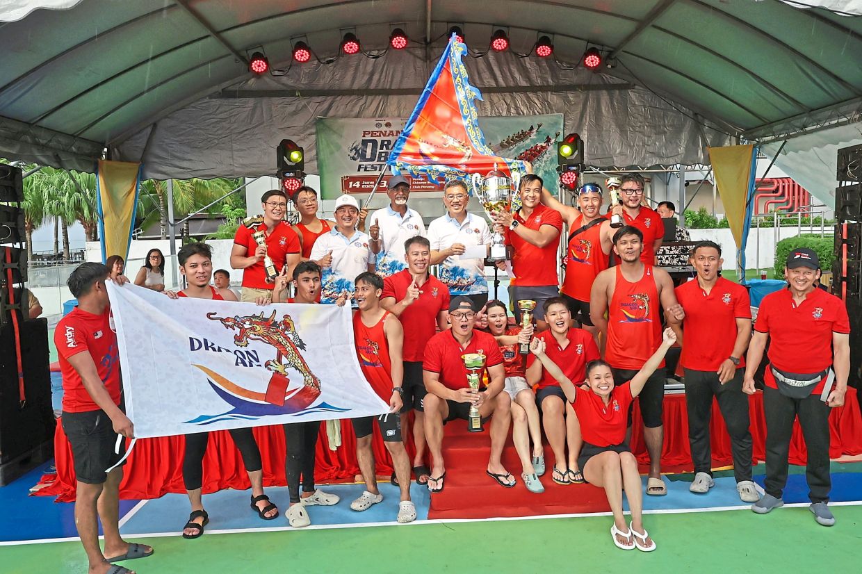 Wong (back row, centre) with team Dragon Ark B which claimed the 22- and 12-crew dragon boat titles. 